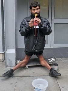 homeless man skaters with inverted knees