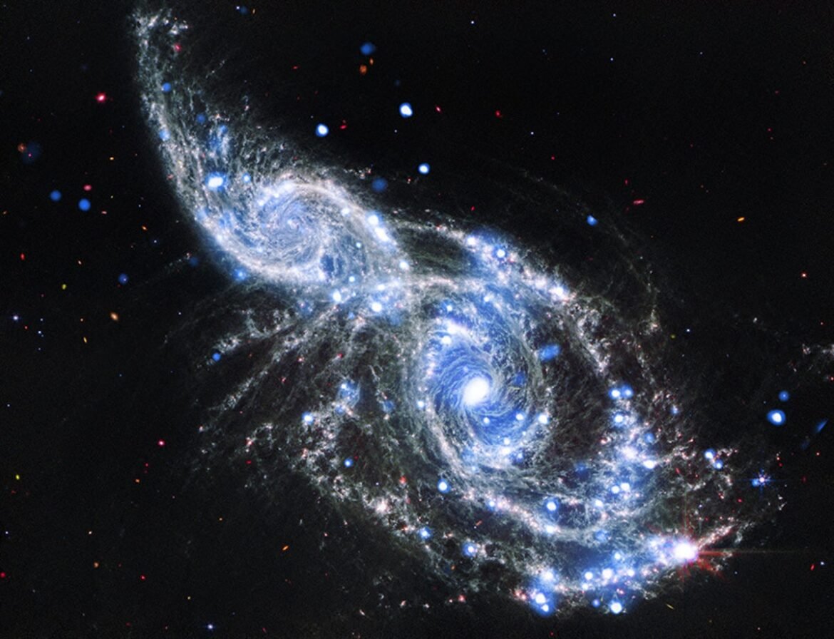 NASA Telescopes Capture Colliding Spiral Galaxies in Sparkling Detail